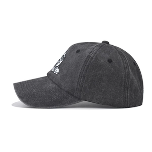Washed dark grey baseball cap with bulldog embroidery and vintage distressed finish