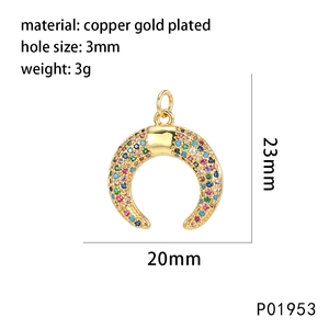 Macro detail of crescent moon pendant with colorful stones and gold-plated finish