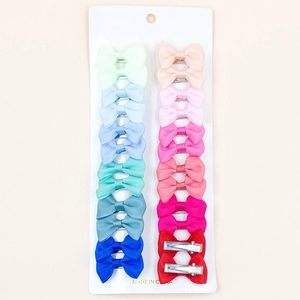 Set of 14 colorful grosgrain ribbon bow duckbill hair clips for girls on white card