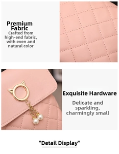 Detail of pink quilted handbag showing premium fabric texture and cat-ear pearl pendant