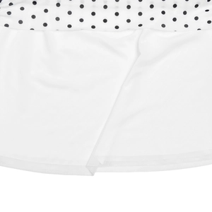 Detail view of the white polka dot top showing soft inner lining and secure stitching