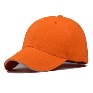 Detailed view of bright orange baseball cap with reinforced stitching and curved brim