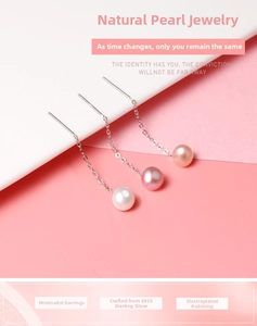 Detail of S925 sterling silver drop earrings with natural white, purple and pink pearls