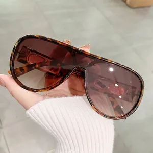Oversized tortoise shell sunglasses with brown gradient lenses and retro square frame