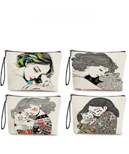 Detail of four canvas pouches featuring cat and girl art prints with black wrist straps