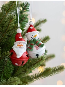 Close-up of Santa and Snowman resin ornaments with red metal bells on a Christmas tree