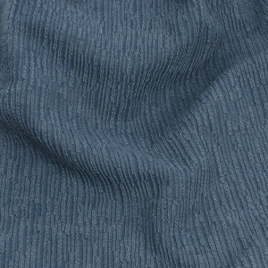 Macro close-up showing the ribbed texture and dark blue knit fabric of this sporty beanie