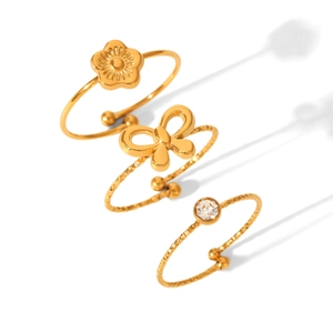 Adjustable gold stainless steel ring set featuring flower bow and solitaire cubic zirconia