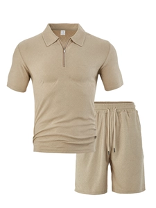 Macro detail of beige textured knit fabric on a men's zip polo shirt and shorts set