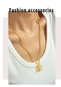 Close-up of model wearing 18k gold plated necklace with rectangular zircon pendant