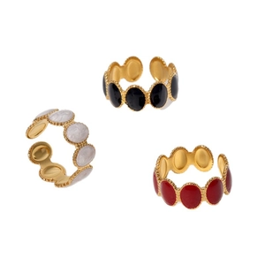 Three gold-plated adjustable stainless steel rings with black white and red enamel oval