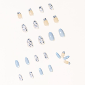 Creamy white and baby blue almond press-on nails with leopard print and French gradient