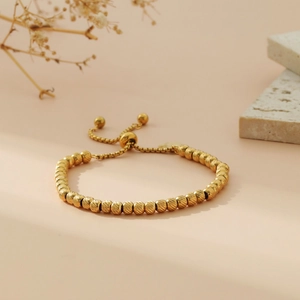 Adjustable gold beaded stainless steel bracelet with textured ball beads for women
