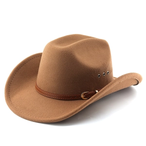 Detail of brown felt western cowboy hat featuring leather band and metal ventilation eyelets