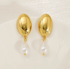 Detailed view of teardrop pearl earrings with 18K gold polished oval metal studs
