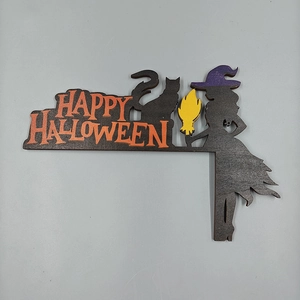 Detail of wooden Halloween corner decor with black cat, purple witch hat and festive text