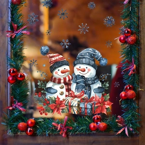 Detailed Christmas window decals showing snowman and snowflake on glass window pane