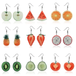 Set of 9 pairs of colorful fruit earrings including watermelon and pineapple on white