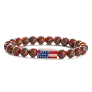 Detail of colorful turquoise beads bracelet featuring a USA flag flag center charm