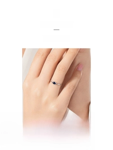 Detailed view of an S925 silver ring featuring a marquise-cut blue sapphire stone
