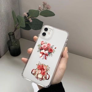 Detailed close-up of a clear phone case featuring watercolor red rose and gift box patterns