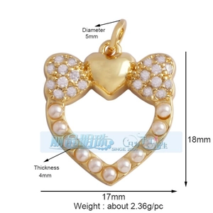 Detailed view of heart pendant with gold plating, bow detail and size measurements