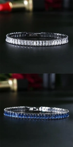 Macro view of baguette-cut zircon tennis bracelets in blue and white with silver plating