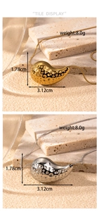 Detailed view of gold and silver teardrop pendants with hammered texture and dimensions