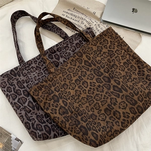 Detailed comparison of brown and grey leopard print suede tote bags for daily commute