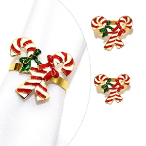 Christmas gold metal napkin ring with red and white candy cane design for table decor