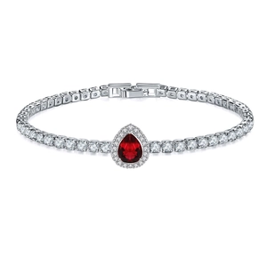 Macro view of pear-cut red gemstone tennis bracelet with cubic zirconia halo detail