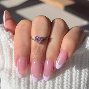 Macro detail of S925 silver adjustable chain ring featuring a pink heart-shaped gemstone