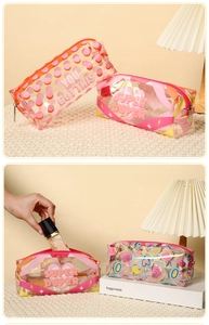 Macro detail of thick waterproof PVC toiletry bags with colorful graphic prints and zippers