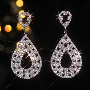 Elegant long teardrop rhinestone drop earrings in silver finish with shimmering crystals