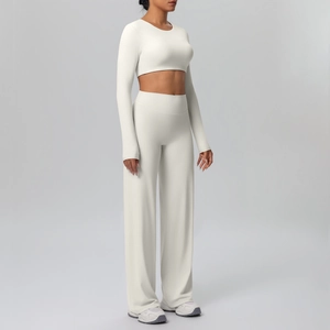 Detail view of cream long sleeve crop top and high waist wide leg yoga pants set