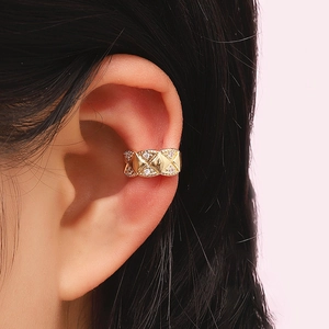 Macro view of gold quilted ear cuff with micro-pave zircons for non-pierced ears
