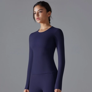 Close-up of slim fit dark navy long sleeve yoga top with high elastic breathable fabric