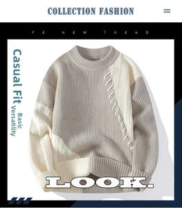 Nahaufnahme des beigen Strickpullovers mit Zopfmuster und Farblock-Details