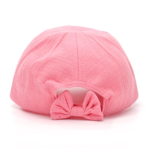 Pink breathable toddler sun hat with a decorative bow on the back against a white background
