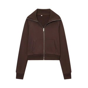 Detailed macro shot of the ribbed collar and metallic zipper on this brown fleece jacket