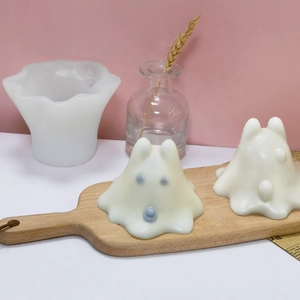 DIY cartoon ghost silicone mold and finished white pudding jelly in a cozy home setting