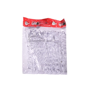Detailed view of clear icicle ornaments with silver strings for Christmas tree decor
