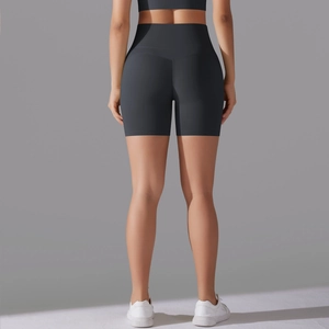 Rear view of high-waisted charcoal grey yoga shorts with curved booty lifting seam detail