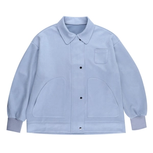 Detail of loose-fit polo collar jacket with rib-knit cuffs and metallic button closures