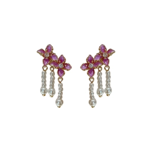 Sweet pink flower pearl earrings with sparkling zircon drop pendants on white background