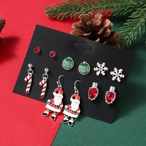 Close-up of 6 pairs Christmas earring set featuring Santa, reindeer, and snowflakes
