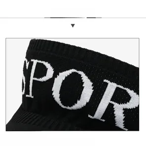 Close-up of black knitted sun visor showing durable seams and SPORT jacquard detail