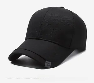 Detailed macro view of black twill baseball cap with silver metal Sport badge