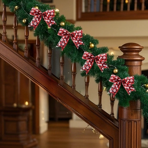 Christmas buffalo plaid dog paw bow on evergreen wreath with warm lights for stairs