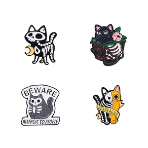 Set of four Halloween cat enamel pins with skull motifs and Gothic cartoon designs